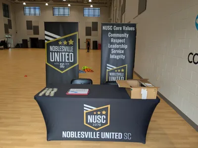 We hosted a referee training for the Indiana Referee Association We have the two banners table cloth and the coins we purchased on the table