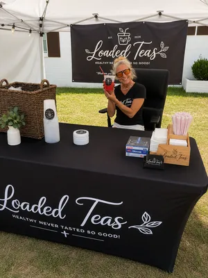 Custom Rectangle Table Covers - Photo of the booth set up with the tablecloth and the banner both purchased from table covers now We are so proud and so excited