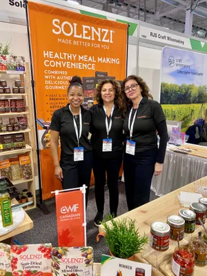 Polyester Mini Desk Flag - Grocery Innovations Canada brings grocery professionals together to discover products exchange ideas and build lasting industry connections The CWIF Table Top Flag appears with women owned brand SOLENZI an innovative maker of Canadian-made pasta sauces authentic pestos high-protein pasta and gourmet specialties that make everyday meals delicious