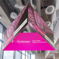 Hanging triangular banner display with branding, suspended in an indoor setting, presumably at a trade show or exhibition.