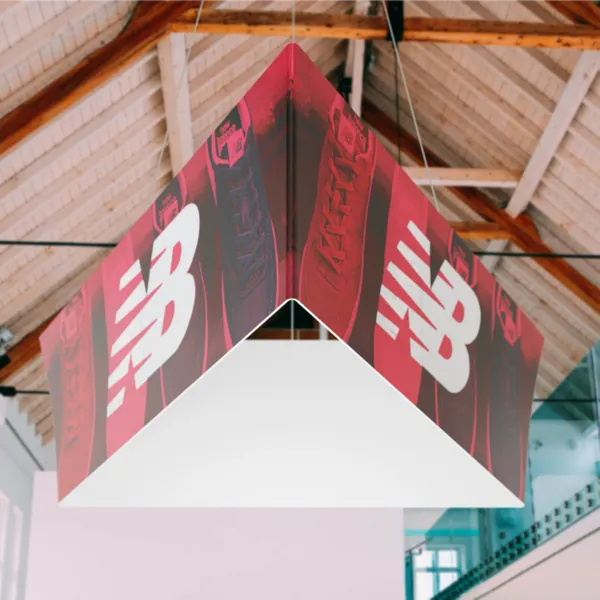 A hanging promotional banner features 'T-Systems' and 'Google Cloud' logos with the slogan 'Let's power higher performance' inside a modern building with exposed ceiling utilities.